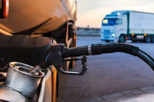 A truck fueling at a diesel pump